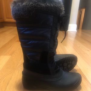 Tall black North Face winter boot